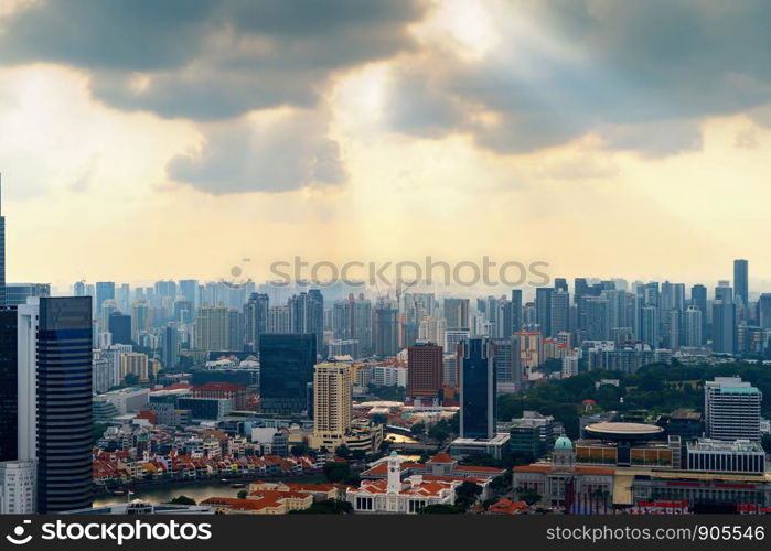 Aerial view of Singapore Downtown skyline at sunset. Financial district and business centers in technology smart urban city in Asia. Skyscraper and high-rise buildings.