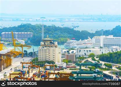 Aerial view of Singapore port, cruise ship and Sentosa island. Singapore