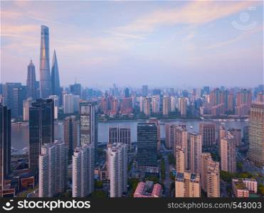 Aerial view of skyscraper and high-rise office buildings in Shanghai Downtown, China. Financial district and business centers in smart city in Asia.