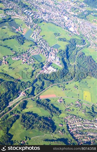 Aerial view of small town near forest&#xA;