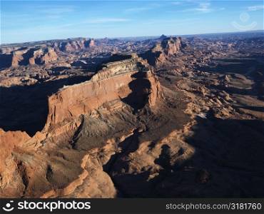 Aerial view of southwest desert with cliffs and rock formations.