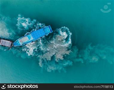 Aerial view of speed boat in jetty wooden pier, Aerial photo, high angle of view. beautiful wave