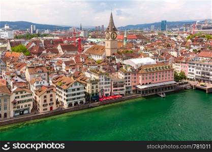 Aerial view of St Peter church, river Limmat and roofs of Old Town of Zurich, the largest city in Switzerland. Zurich, the largest city in Switzerland