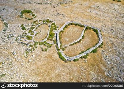 Aerial view of stone shepherd fences called Mrgari on Moon Plateau stone desert, Island of Krk heights, Croatia