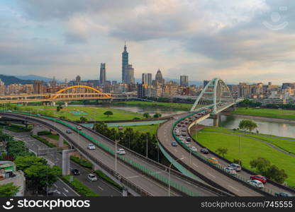 Aerial view of Taipei Downtown, Taiwan. Financial district and business centers in smart urban city. Skyscraper and high-rise buildings at sunset.