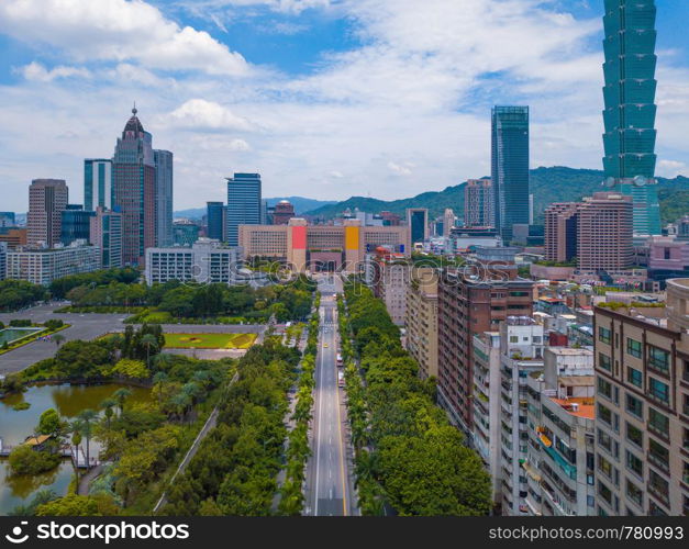 Aerial view of Taipei Downtown, Taiwan. Financial district and business centers in smart urban city. Skyscraper and high-rise buildings.