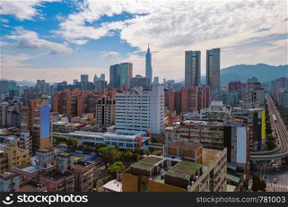 Aerial view of Taipei Downtown, Taiwan. Financial district and business centers in smart urban city. Skyscraper and high-rise buildings.