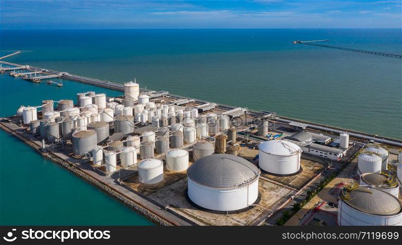 Aerial view of tank terminal with lots of oil storage tank and petrochemical storage tank in the harbour, Industrial tank storage aerial view.