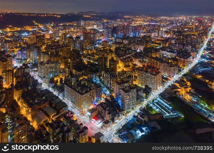 Aerial view of Taoyuan Downtown, Taiwan. Financial district and business centers in smart urban city. Skyscraper and high-rise buildings at night.