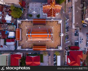 Aerial view of temple, Wat Devaraj Kunchorn Worawihan, Thai architectures. Close up of red roofs. Top view.