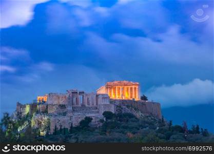 Aerial view of the Acropolis Hill, crowned with Parthenon during evening blue hour in Athens, Greece. Acropolis Hill and Parthenon in Athens, Greece