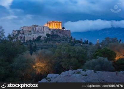 Aerial view of the Acropolis Hill, crowned with Parthenon during evening blue hour in Athens, Greece. Acropolis Hill and Parthenon in Athens, Greece