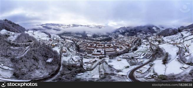 Aerial view of the Asturian town of Blimea under a snowfall, Spain