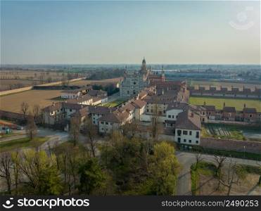 Aerial view of the Certosa di Pavia at morning, built in the late fourteenth century, courts and the cloister of the monastery and shrine in the province of Pavia, Lombardia, Italy