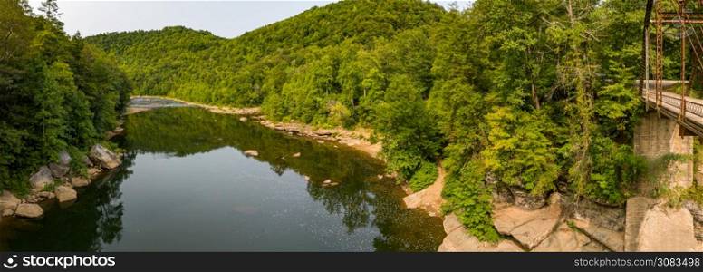 Aerial view of the Cheat River near the 1912 metal truss Jenkinsburg Bridge near Mt Nebo and Morgantown over Cheat River. Drone view of the Cheat river by Jenkinsburg Bridge near Morgantown