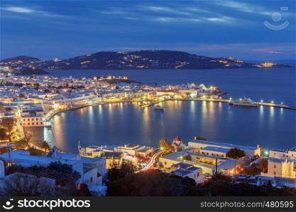 Aerial view of the city Chora from a hill on the sunset. Greece. The island Mykonos.. Chora. Mykonos. Aerial view of the city.