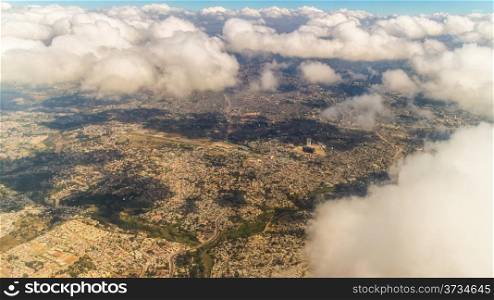 Aerial view of the city of Addis Ababa covered by sparsely distributed clouds