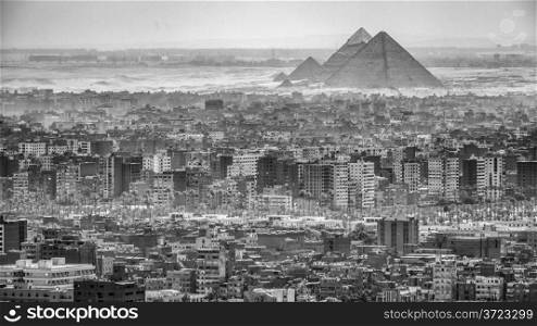 Aerial view of the city of Cairo with the Pyramids in the background