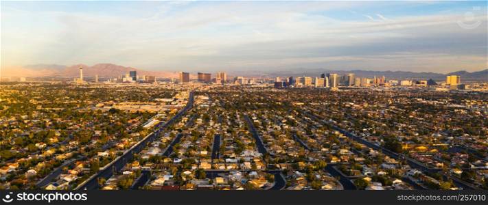 Aerial view of the entire length of Las Vegas Strip with surrounding homes and retail space