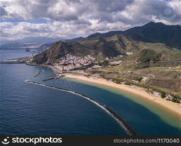 Aerial view of the famous white sand beach Playa de Las Teresitas with scenic San Andres village. Tenerife, Canary Islands, Spain