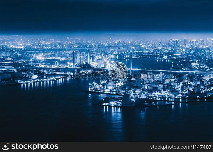Aerial view of the ferris wheel, Tempozan The Riverfront, near Osaka Bay with skyscraper buildings in Osaka Kansai Downtown skyline, urban city, Japan. Architecture landscape background.