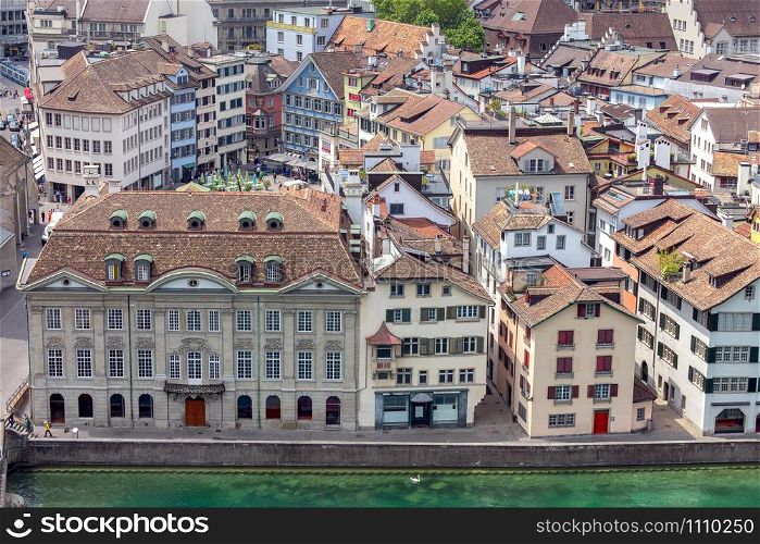 Aerial view of the historical part of the city on a sunny day. Zurich. Switzerland.. Aerial view of city rooftops and towers. Zurich. Switzerland.