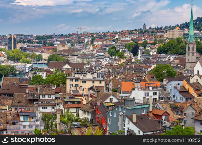 Aerial view of the historical part of the city on a sunny day. Zurich. Switzerland.. Aerial view of city rooftops and towers. Zurich. Switzerland.