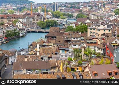 Aerial view of the historical part of the city on a sunny day. Zurich. Switzerland.. Aerial view of city rooftops and towers. Zurich. Switzerland.