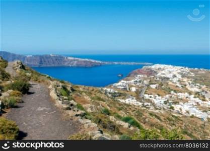 Aerial view of the island Santorini.. The picturesque aerial view from the mountains to the village Oia and the bay.