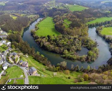 Aerial view of the meanders of the Navia river in Asturias, Spain.