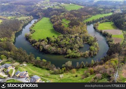 Aerial view of the meanders of the Navia river in Asturias, Spain.