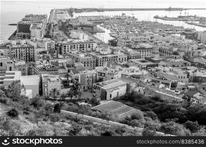 Aerial view of the Mediterranean city of Alicante, Spain; black and white image