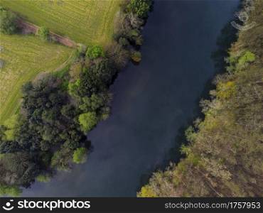 Aerial view of the Navia river and its meadows in Asturias, Spain