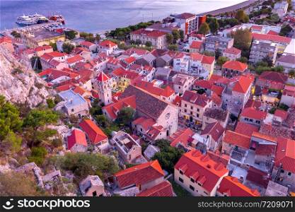 Aerial view of the old medieval historic city at sunset. Omis. Croatia.. Aerial view of Omis at sunset.