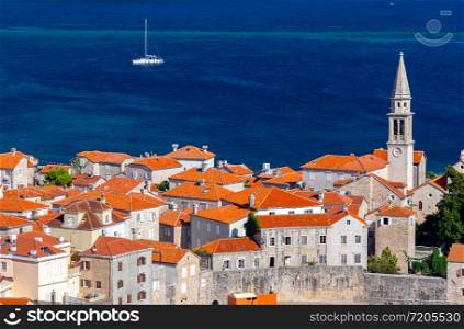 Aerial view of the old medieval historic city on a sunny day. Budva. Montenegro. Aerial view of Budva on a sunny day.
