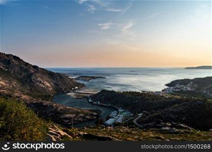 Aerial view of the Ria de Corcubion and Finisterre&rsquo;s Cape from the top of Mount Pindo at dusk.