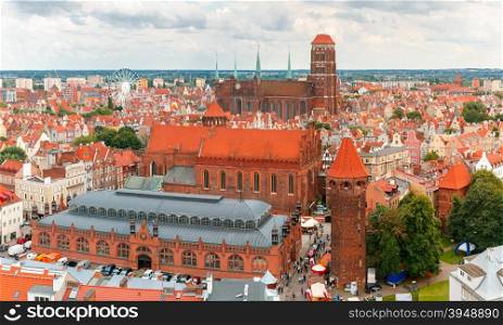 Aerial view of the Saint Mary Church, Market Hall and Tower Jacek in the cloudy summer morning, Gdansk, Poland