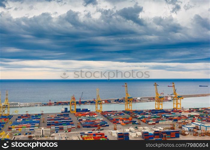 Aerial view of the sea cargo port and container terminal of Barcelona with the Montjuic hill, Barcelona, Catalonia, Spain.