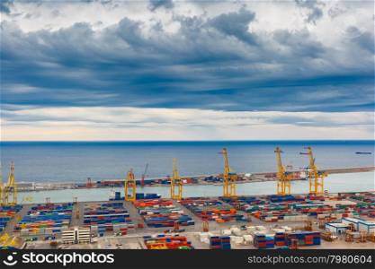 Aerial view of the sea cargo port and container terminal of Barcelona with the Montjuic hill, Barcelona, Catalonia, Spain.