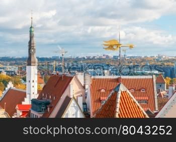 Aerial view of the tiled roofs, spiers and streets in the historical part of old Tallinn.