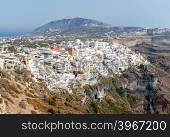 Aerial view of the traditional white houses of Fira. Santorini. Greece.. Fira. Aerial view of the city.