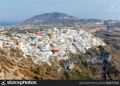 Aerial view of the traditional white houses of Fira. Santorini. Greece.. Fira. Aerial view of the city.