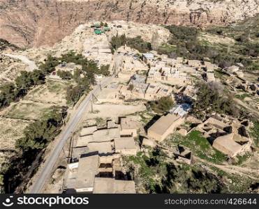 Aerial view of the village Dana and its surroundings at the edge of the Biosphere Reserve of Dana in Jordan, made with drone