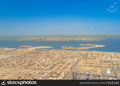 Aerial view of The World Islands on Dubai sea with sunset sky, United Arab Emirates or UAE. Architecture landscape background with sky.