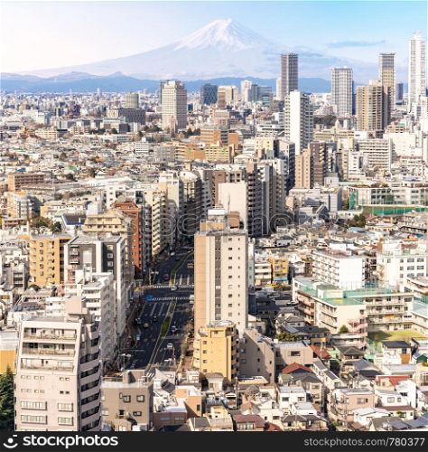 aerial view of Tokyo skylines and skyscrapers buildings in Shinjuku ward in Tokyo with Mountain Fuji in background