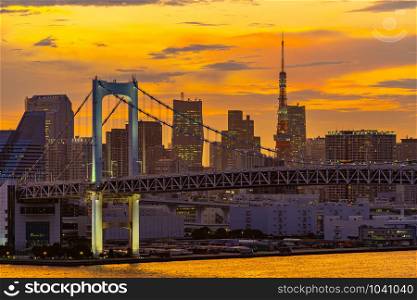 Aerial view of Tokyo skylines with Rainbow bridge and tokyo tower over Tokyo bay Sunset Twilight from Odaiba in Tokyo city Kanto Japan.