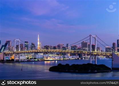 Aerial view of Tokyo skylines with Rainbow bridge and tokyo tower over Tokyo bay Sunrise dawn Twilight from Odaiba in Tokyo city Kanto Japan.