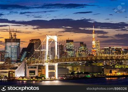 Aerial view of Tokyo skylines with Rainbow bridge and tokyo tower over Tokyo bay Sunset Twilight from Odaiba in Tokyo city Kanto Japan.
