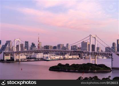 Aerial view of Tokyo skylines with Rainbow bridge and tokyo tower over Tokyo bay Sunrise dawn Twilight from Odaiba in Tokyo city Kanto Japan.