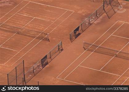 aerial view of two clay tennis courts